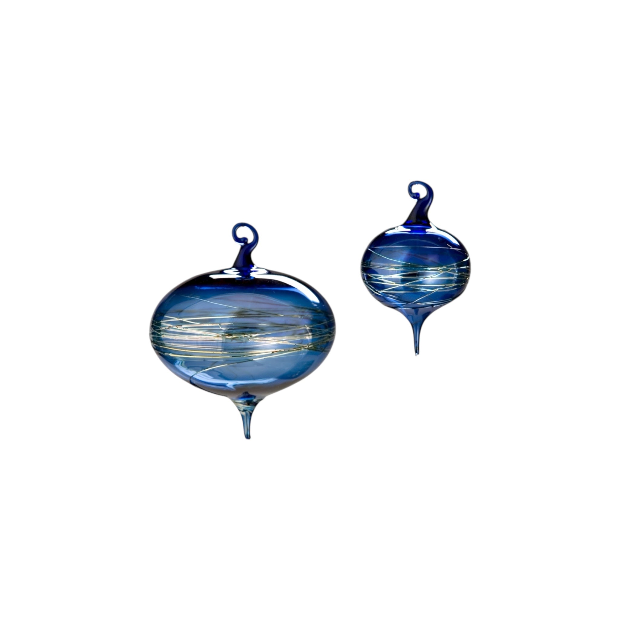 Two blue glass ornaments with swirling patterns on a white background