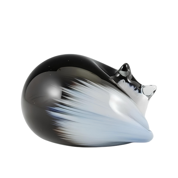 Black Sleeping Cat with White Face and Tail